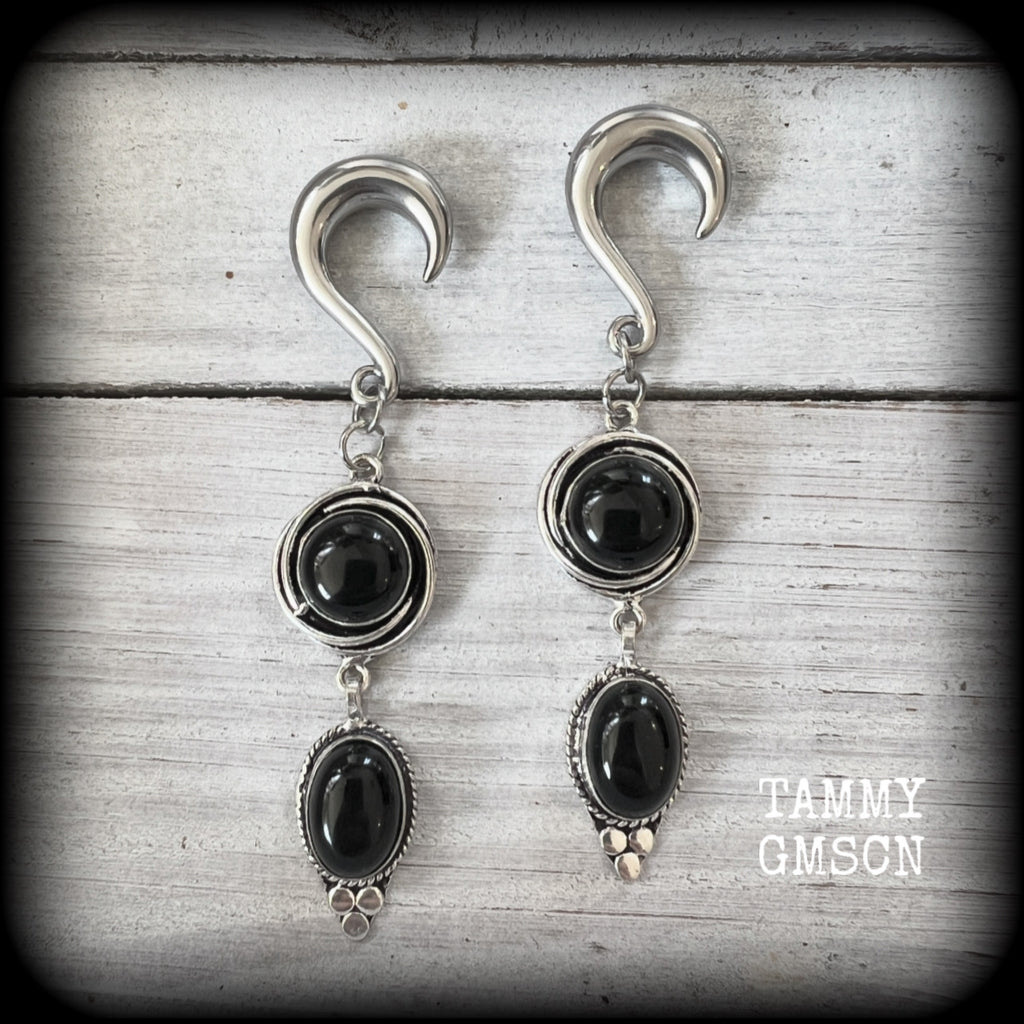 These gauged earrings have been made with gorgeous pitch black polished obsidian gemstones in a beautiful boho antique silver setting, measuring just under 9cms from tip to tip, and weighing approx 12 grams each, nice and lightweight.

These earrings have been made on 2 gauge (6mm) surgical steel half curl hooks, to be worn in stretched lobes.

