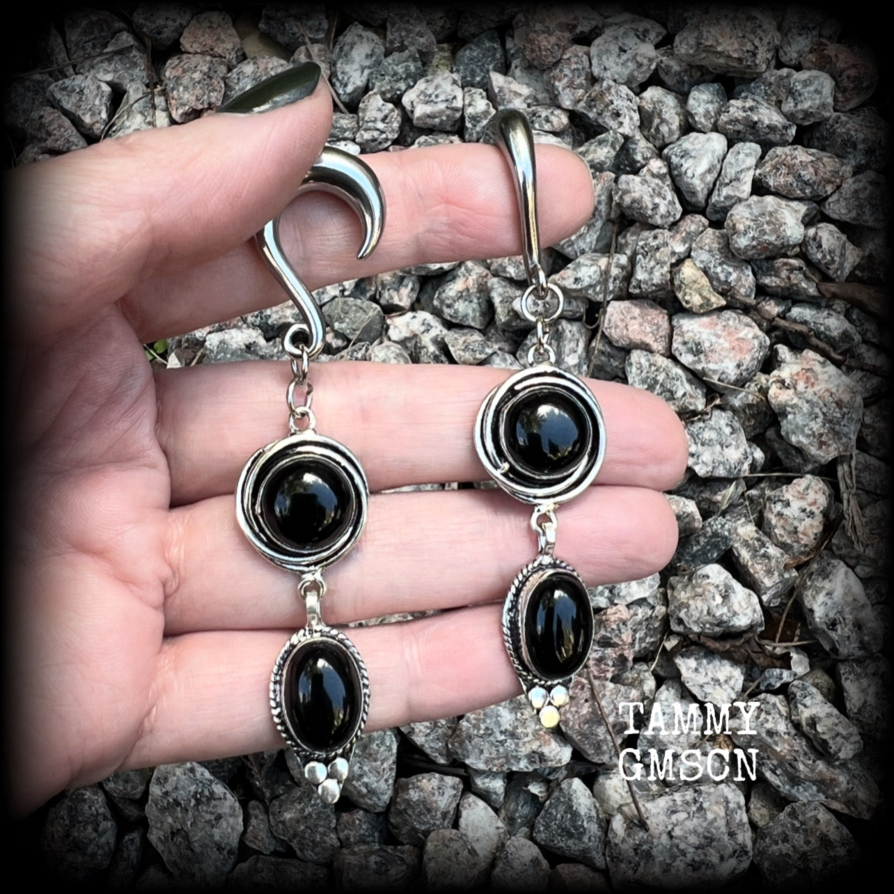 These gauged earrings have been made with gorgeous pitch black polished obsidian gemstones in a beautiful boho antique silver setting, measuring just under 9cms from tip to tip, and weighing approx 12 grams each, nice and lightweight.

These earrings have been made on 2 gauge (6mm) surgical steel half curl hooks, to be worn in stretched lobes.
