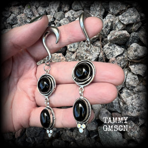 These gauged earrings have been made with gorgeous pitch black polished obsidian gemstones in a beautiful boho antique silver setting, measuring just under 9cms from tip to tip, and weighing approx 12 grams each, nice and lightweight.

These earrings have been made on 2 gauge (6mm) surgical steel half curl hooks, to be worn in stretched lobes.
