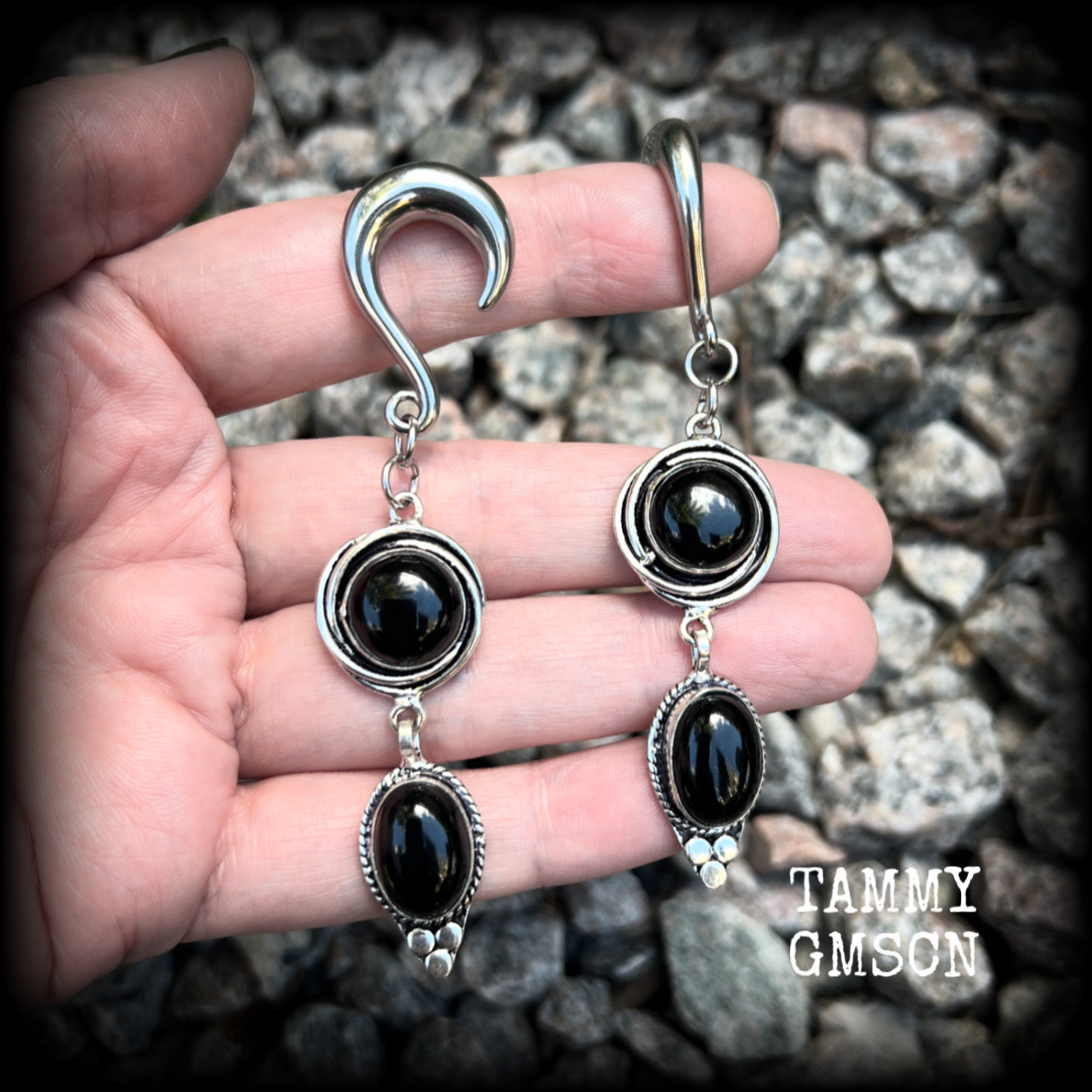 These gauged earrings have been made with gorgeous pitch black polished obsidian gemstones in a beautiful boho antique silver setting, measuring just under 9cms from tip to tip, and weighing approx 12 grams each, nice and lightweight.

These earrings have been made on 2 gauge (6mm) surgical steel half curl hooks, to be worn in stretched lobes.
