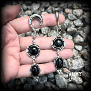 These gauged earrings have been made with gorgeous pitch black polished obsidian gemstones in a beautiful boho antique silver setting, measuring just under 9cms from tip to tip, and weighing approx 12 grams each, nice and lightweight.

These earrings have been made on 2 gauge (6mm) surgical steel half curl hooks, to be worn in stretched lobes.
