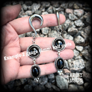 These gauged earrings have been made with gorgeous pitch black polished obsidian gemstones in a beautiful boho antique silver setting, measuring just under 9cms from tip to tip, and weighing approx 12 grams each, nice and lightweight.

These earrings have been made on 2 gauge (6mm) surgical steel half curl hooks, to be worn in stretched lobes.
