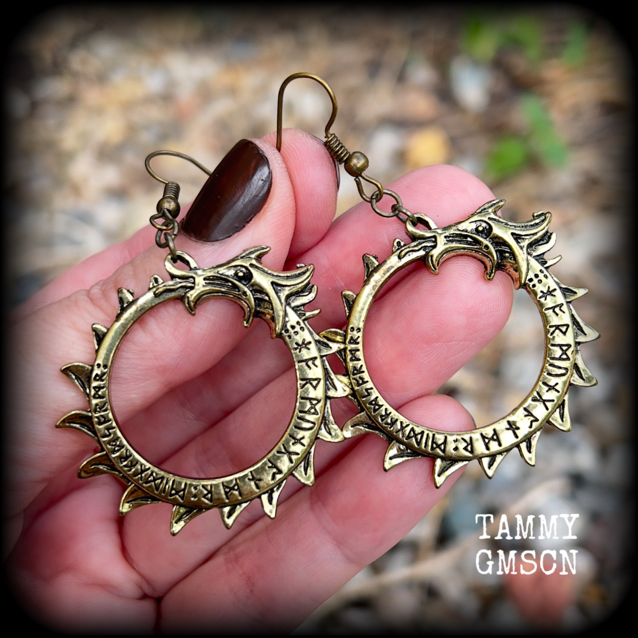 These gorgeous earrings feature a bright antique bronze Ouroborous snake inscribed with runes, measuring just on 6.5cms, nice and light weight at approx 6 grams each.

This pair has been made with antique bronze french hooks suitable for pierced ears.