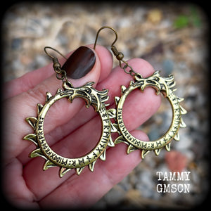 These gorgeous earrings feature a bright antique bronze Ouroborous snake inscribed with runes, measuring just on 6.5cms, nice and light weight at approx 6 grams each.

This pair has been made with antique bronze french hooks suitable for pierced ears.