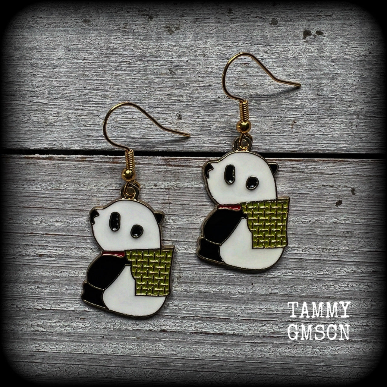 Super cute and super light weight, these earrings feature cute panda bear enamel charms, measuring just over 4cms from tip to tip and weighing only a few grams each.
This pair has been made with antique gold french hooks, for pierced ears.
