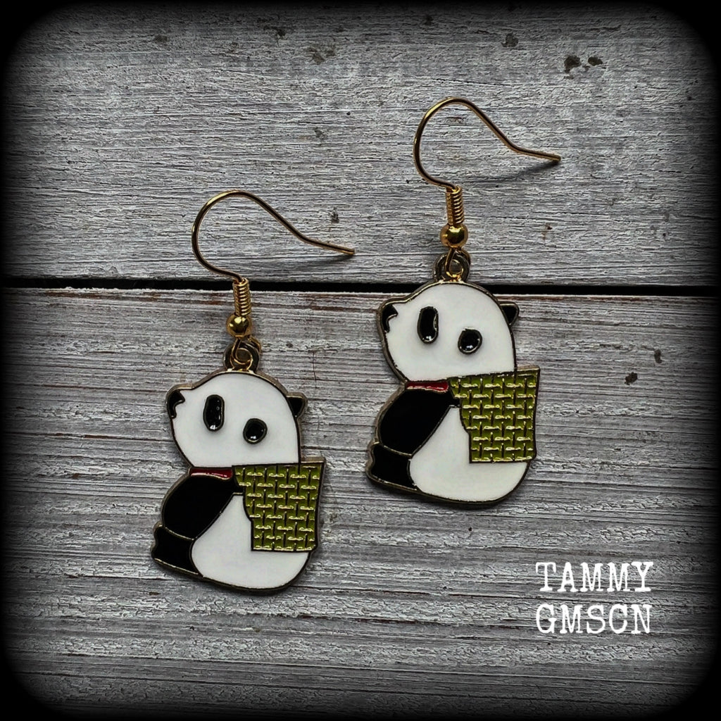 Super cute and super light weight, these earrings feature cute panda bear enamel charms, measuring just over 4cms from tip to tip and weighing only a few grams each.
This pair has been made with antique gold french hooks, for pierced ears.
