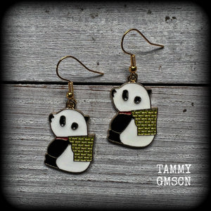 Super cute and super light weight, these earrings feature cute panda bear enamel charms, measuring just over 4cms from tip to tip and weighing only a few grams each.
This pair has been made with antique gold french hooks, for pierced ears.
