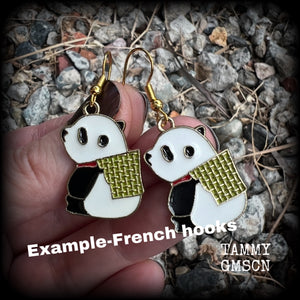 Super cute and super light weight, these earrings feature cute panda bear enamel charms, measuring just over 4cms from tip to tip and weighing only a few grams each.
This pair has been made with antique gold french hooks, for pierced ears.
