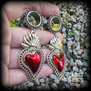 These tunnel earrings feature gorgeous blood red enamel and antique silver sacred hearts, nice and lightweight at approx 13 grams each and measure approx 7.5cms from tip to tip.
This pair has made on 5/8" (16mm) gauge ornate surgical steel screw fit tunnels, for stretched lobes.