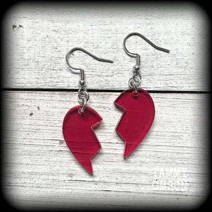 This pair of earrings feature a red acrylic heart broken in two, measuring just over 5cms from tip to tip, these earrings are lovely and lightweight, weighing only a few grams each.
This pair has been made on stainless steel french hooks, suitable for pierced ears.