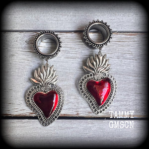 These tunnel earrings feature gorgeous blood red enamel and antique silver sacred hearts, nice and lightweight at approx 13 grams each and measure approx 7.5cms from tip to tip.
This pair has made on 5/8" (16mm) gauge ornate surgical steel screw fit tunnels, for stretched lobes.