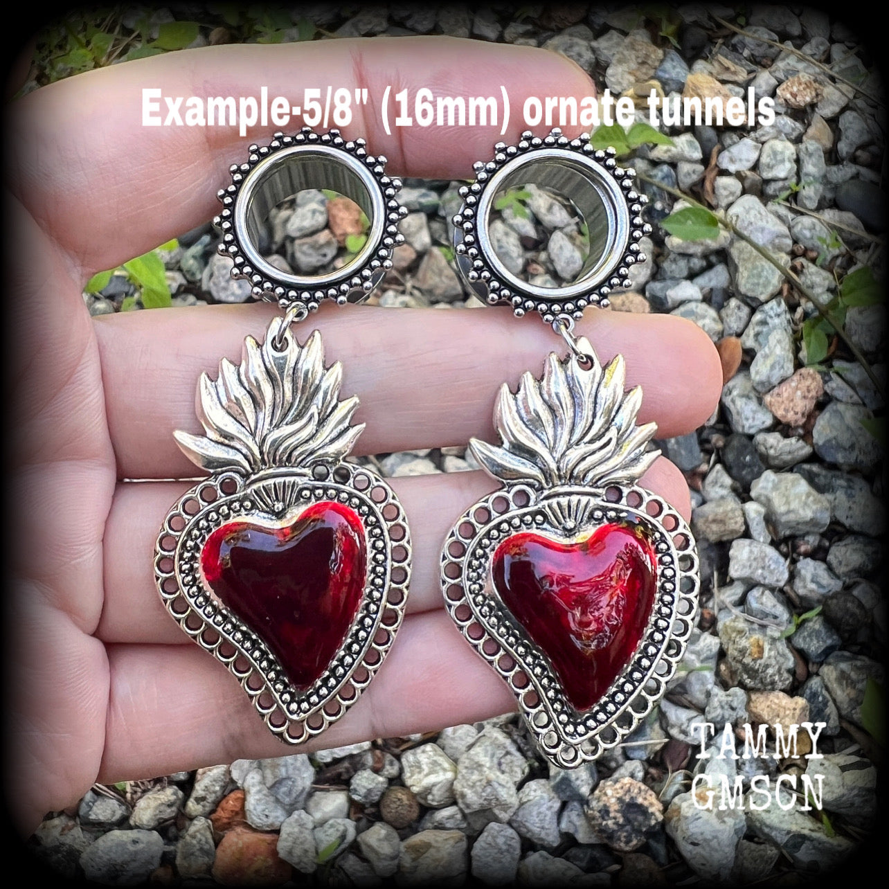 These tunnel earrings feature gorgeous blood red enamel and antique silver sacred hearts, nice and lightweight at approx 13 grams each and measure approx 7.5cms from tip to tip.
This pair has made on 5/8" (16mm) gauge ornate surgical steel screw fit tunnels, for stretched lobes.