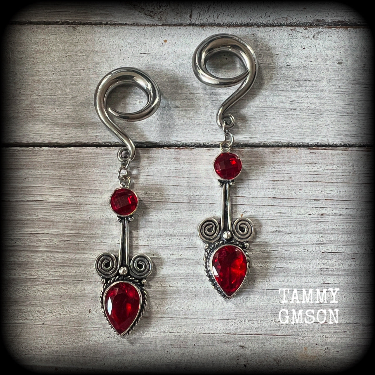 These stunning dangly gauged earrings feature gorgeous deep red faceted garnet gemstones in a beautiful boho antique silver setting, measuring just over 8cms from tip to tip, and weigh approx 12 grams each.

This pair have been made with 2 gauge (6mm) surgical steel full curl hooks, to be worn in stretched lobes.