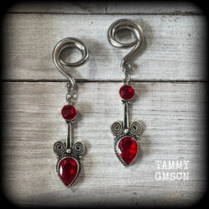These stunning dangly gauged earrings feature gorgeous deep red faceted garnet gemstones in a beautiful boho antique silver setting, measuring just over 8cms from tip to tip, and weigh approx 12 grams each.

This pair have been made with 2 gauge (6mm) surgical steel full curl hooks, to be worn in stretched lobes.