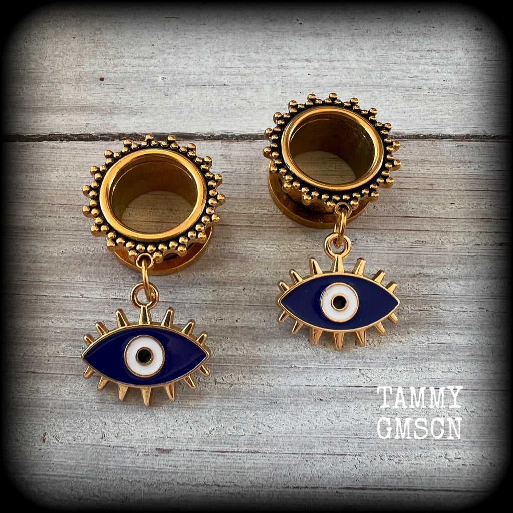These stunning tunnel earrings feature gorgeous blue and white enamel and antique gold turkish evil eye charms, are nice and lightweight, weighing approx 10 grams each, measuring approx 5cms from tip to tip.

This pair has been made on 3/4” (19mm) gauge ornate surgical steel screw fit tunnels.