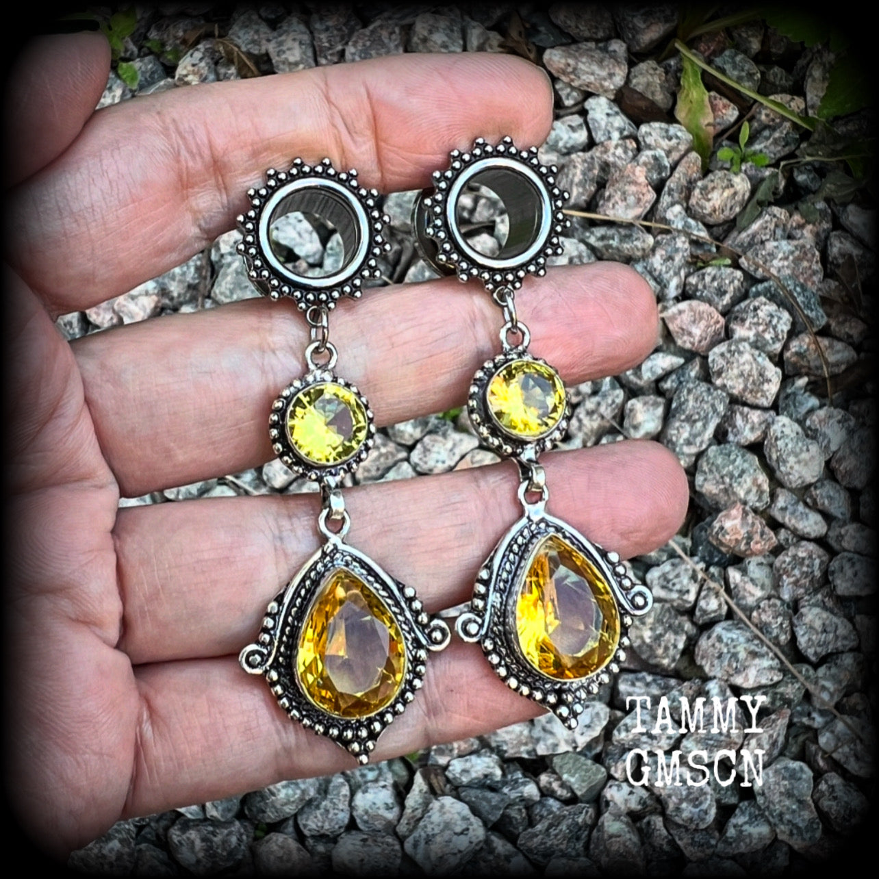 These gorgeous boho tunnel earrings have been made with beautiful yellow citrine gemstones in an antique silver setting, are light weight weighing approx 11 grams each and measure just over 7cms from tip to tip.  This pair have been made with  1/2” gauge (12mm) ornate surgical steel screw fit tunnels, for stretched lobes.