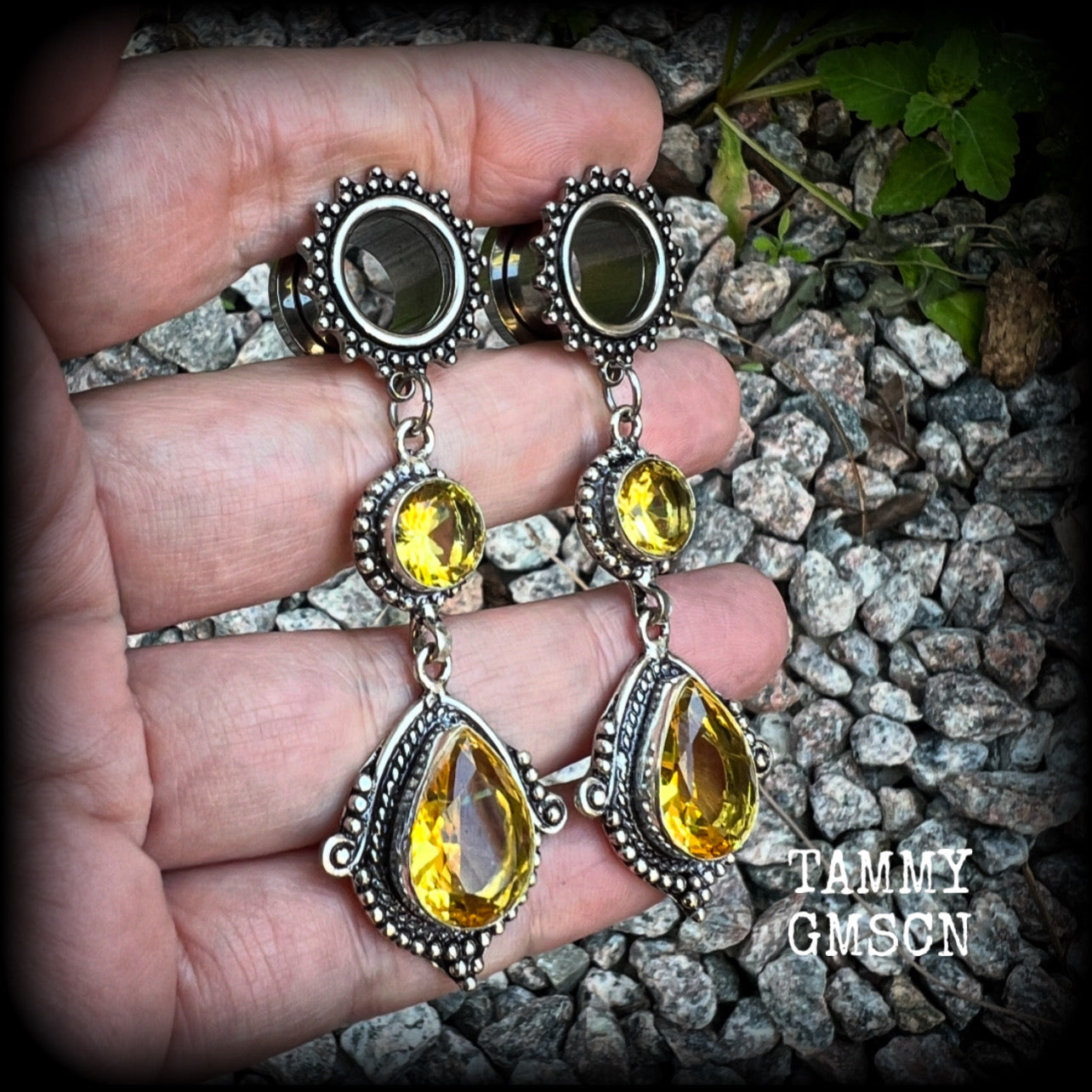 These gorgeous boho tunnel earrings have been made with beautiful yellow citrine gemstones in an antique silver setting, are light weight weighing approx 11 grams each and measure just over 7cms from tip to tip.  This pair have been made with  1/2” gauge (12mm) ornate surgical steel screw fit tunnels, for stretched lobes.