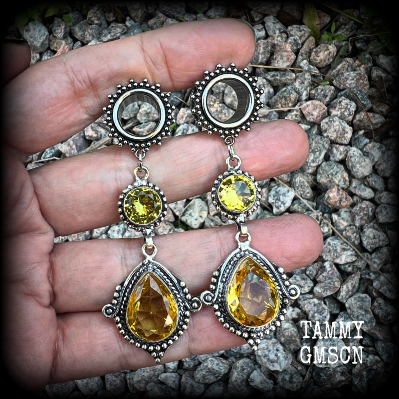 These gorgeous boho tunnel earrings have been made with beautiful yellow citrine gemstones in an antique silver setting, are light weight weighing approx 11 grams each and measure just over 7cms from tip to tip.  This pair have been made with  1/2” gauge (12mm) ornate surgical steel screw fit tunnels, for stretched lobes.