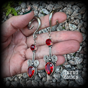 These stunning dangly gauged earrings feature gorgeous deep red faceted garnet gemstones in a beautiful boho antique silver setting, measuring just over 8cms from tip to tip, and weigh approx 12 grams each.  This pair have been made with 2 gauge (6mm) surgical steel full curl hooks, to be worn in stretched lobes.
