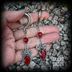 These stunning dangly gauged earrings feature gorgeous deep red faceted garnet gemstones in a beautiful boho antique silver setting, measuring just over 8cms from tip to tip, and weigh approx 12 grams each.  This pair have been made with 2 gauge (6mm) surgical steel full curl hooks, to be worn in stretched lobes.
