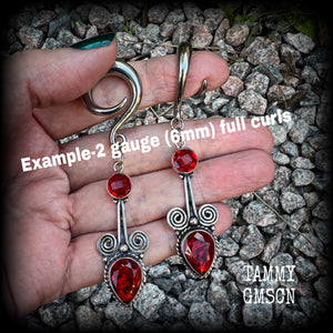 These stunning dangly gauged earrings feature gorgeous deep red faceted garnet gemstones in a beautiful boho antique silver setting, measuring just over 8cms from tip to tip, and weigh approx 12 grams each.  This pair have been made with 2 gauge (6mm) surgical steel full curl hooks, to be worn in stretched lobes.