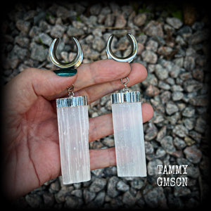 These gorgeous gauged earrings feature beautiful big selenite pieces, measuring just over 10cms from tip to tip, and weighing approx 25grams each.  This pair have been made on 3/4” gauge (19mm) surgical steel cradles, to be worn in stretched lobes.