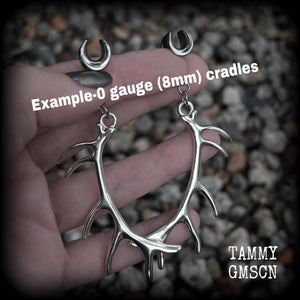 These gauged earrings feature  antique silver antler pendants, measuring just over 9cms from tip to tip, and weighing approx 11 grams each.  This pair has been made on 0 gauge (8mm)  surgical steel cradles, suitable for stretched lobes.