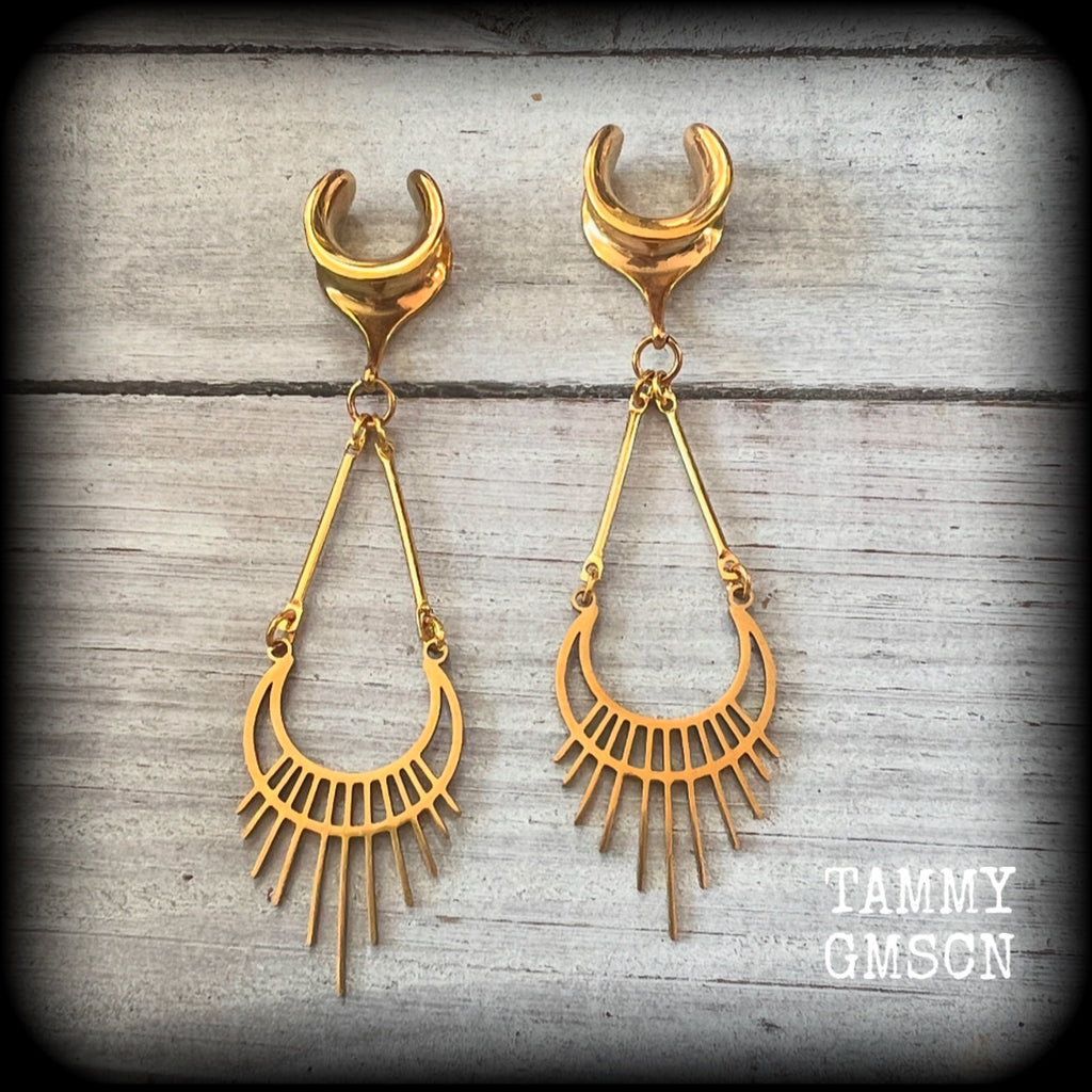 Inspired by Ishtar, Mesopotamian Goddess of love, beauty, sex and war, this beautiful pair of earrings features a golden stainless steel crescent moon with sunrays, measuring just on 8cms from tip to tip, and weighing only 5 grams a piece.

This pair has been made on 1/2” gauge (12mm) surgical steel cradles, to be worn in stretched lobes.