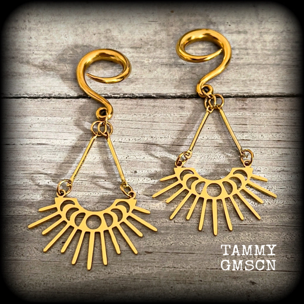 These beautiful witchy titanium 'Moon phase' gauged earrings feature gorgeous antique gold moon phase pendants with sun rays, nice and dangly, measuring just over 7.5cms from tip to tip, and weighing only 5 grams a piece .

This pair has been made on 6 gauge (4mm) surgical steel full curl hooks, to be worn in stretched lobes.