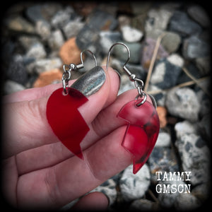 This pair of earrings feature a red acrylic heart broken in two, measuring just over 5cms from tip to tip, these earrings are lovely and lightweight, weighing only a few grams each. This pair has been made on stainless steel french hooks