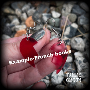 This pair of earrings feature a red acrylic heart broken in two, measuring just over 5cms from tip to tip, these earrings are lovely and lightweight, weighing only a few grams each. This pair has been made on stainless steel french hooks