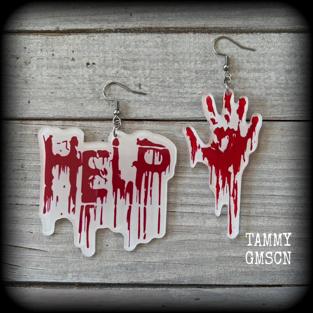 These awesome horror movie inspired earrings feature a bloodied hand print alongside ‘HELP’ finger painted in blood, measuring approx 7.5cms from tip to tip, and weigh only a few grams each.

This pair has been made with stainless steel french hooks, suitable for pierced ears.