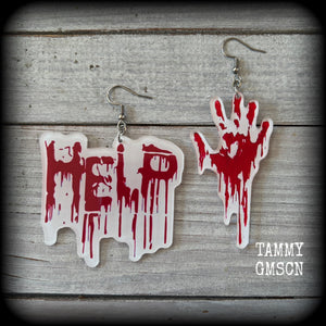 These awesome horror movie inspired earrings feature a bloodied hand print alongside ‘HELP’ finger painted in blood, measuring approx 7.5cms from tip to tip, and weigh only a few grams each.

This pair has been made with stainless steel french hooks, suitable for pierced ears.