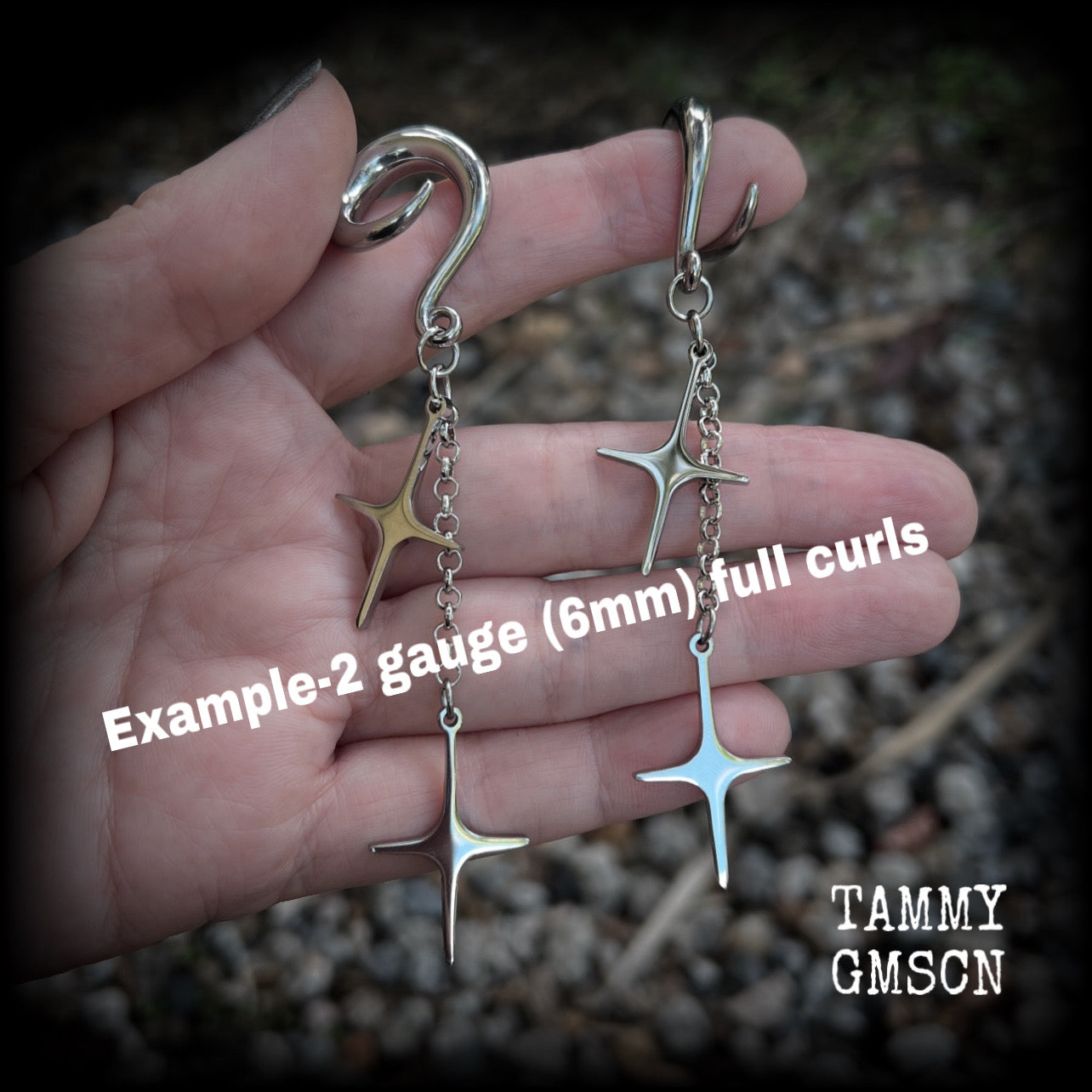 Measuring just over 10cms from tip to tip, these earrings feature fabulously kitschy retro stars dangling from stainless steel chains, weighing approx. 5 grams a piece. This pair has been made on 2 gauge (6mm) surgical steel full curl hooks