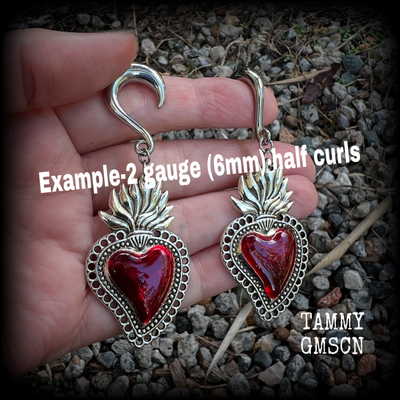 These earrings feature gorgeous blood red enamel and antique silver sacred hearts, weighing approx 13 grams each and measure approx 7.5cms from tip to tip. This pair has made with 2 gauge surgical steel half curls
