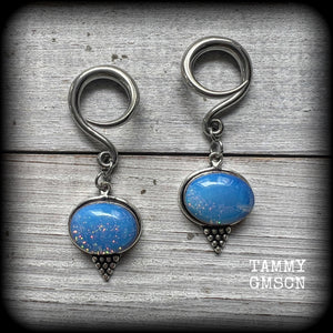 These gorgeous gauged earrings feature a pair of polished fire opals, lovely and dangly measuring approx 5.5cms from tip to tip, and weigh approx 7 grams each.
This pair has been made on 6 gauge (4mm) surgical steel full curl hooks, suitable for stretched lobes.