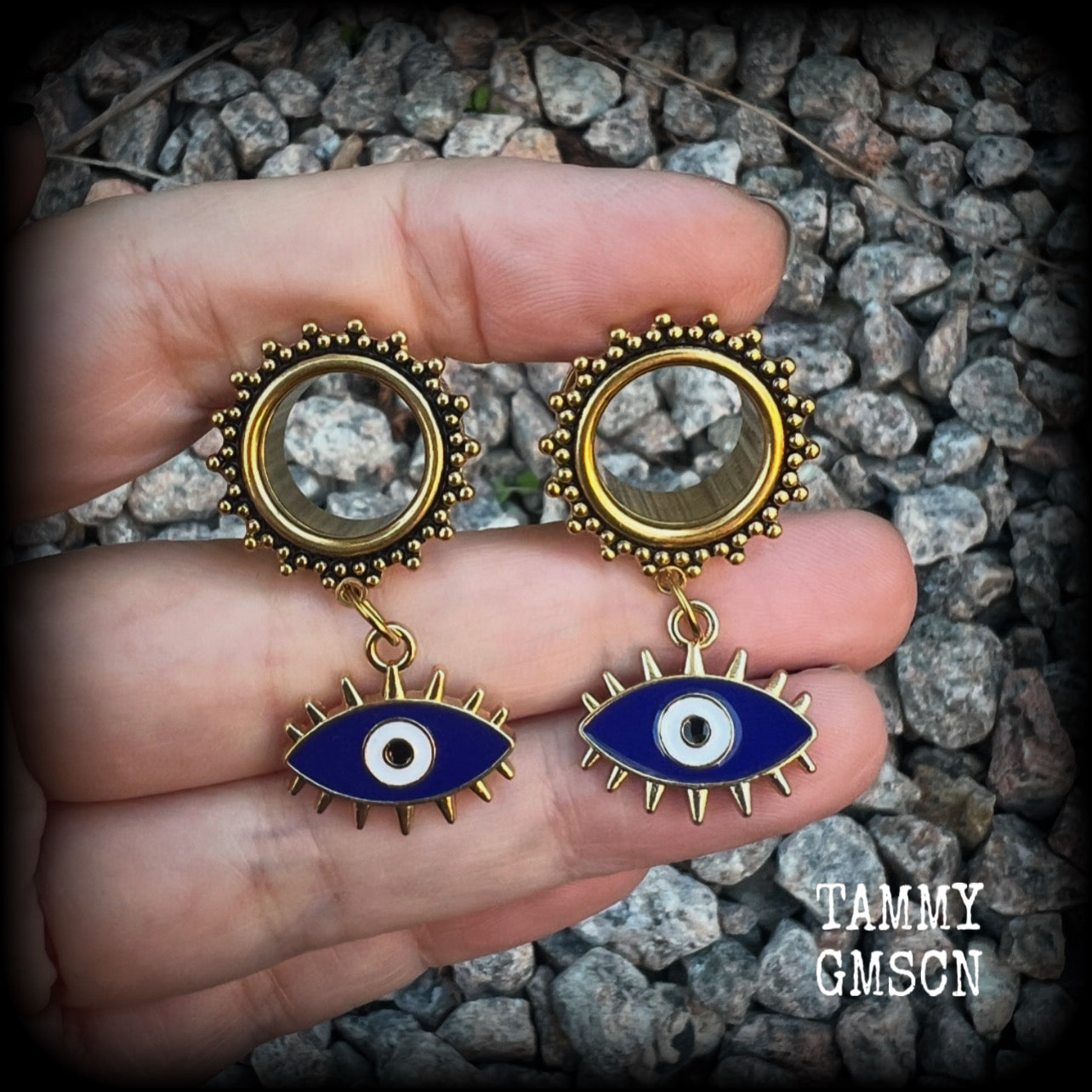 These stunning tunnel earrings feature gorgeous blue and white enamel and antique gold turkish evil eye charms, are nice and lightweight, weighing approx 10 grams each, measuring approx 5cms from tip to tip.

This pair has been made on 3/4” (19mm) gauge ornate surgical steel screw fit tunnels.