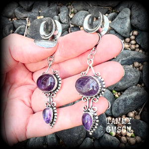 These gorgeous gauged earrings feature beautiful deep purple polished amethyst gemstones in an antique silver boho setting, measuring 7.5cms from tip to tip, and weighing approx 9 grams each, not too heavy...
This pair have been made on 1/2” gauge (12mm) surgical steel cradles-suitable for stretched lobes.