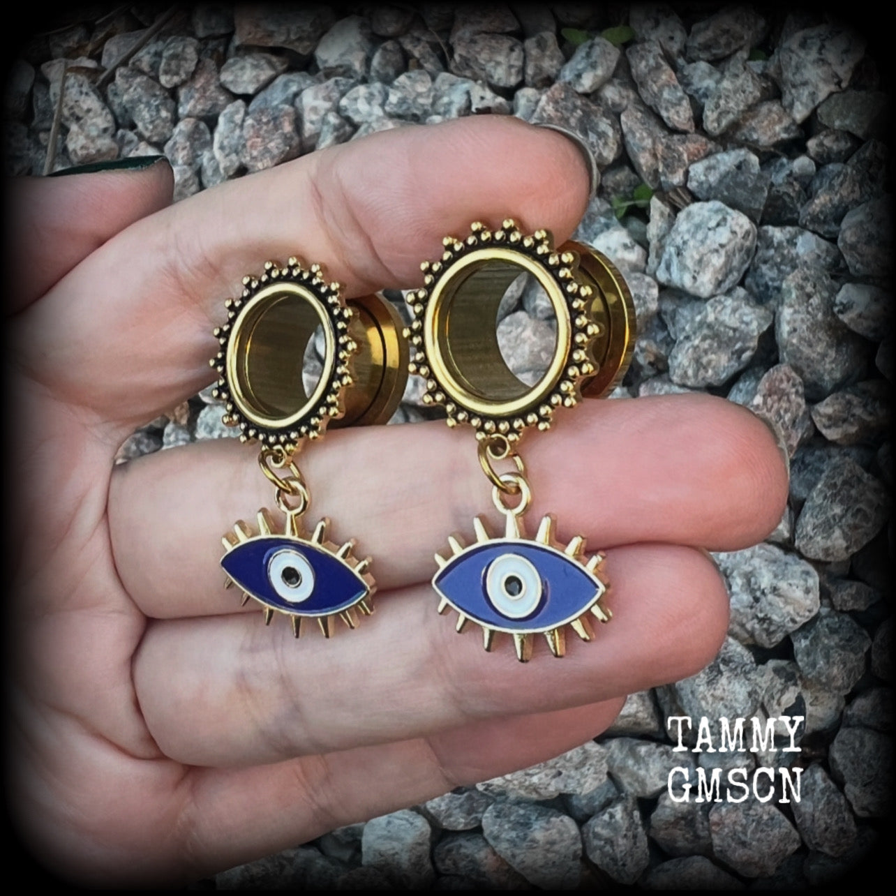 These stunning tunnel earrings feature gorgeous blue and white enamel and antique gold turkish evil eye charms, are nice and lightweight, weighing approx 10 grams each, measuring approx 5cms from tip to tip.

This pair has been made on 3/4” (19mm) gauge ornate surgical steel screw fit tunnels.