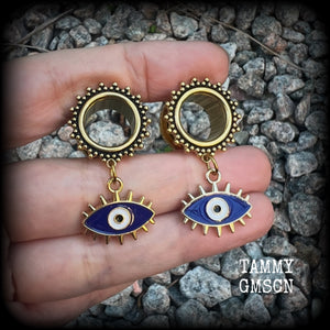 These stunning tunnel earrings feature gorgeous blue and white enamel and antique gold turkish evil eye charms, are nice and lightweight, weighing approx 10 grams each, measuring approx 5cms from tip to tip.

This pair has been made on 3/4” (19mm) gauge ornate surgical steel screw fit tunnels.