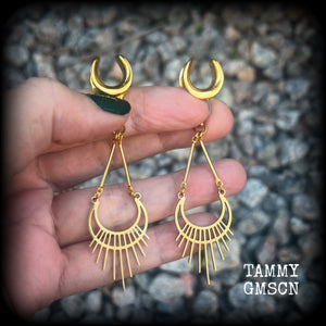 Inspired by Ishtar, Mesopotamian Goddess of love, beauty, sex and war, this beautiful pair of earrings features a golden stainless steel crescent moon with sunrays,  measuring just on 8cms from tip to tip, and weighing only 5 grams a piece.

This pair has been made on 1/2” gauge (12mm) surgical steel cradles, to be worn in stretched lobes.