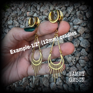 Inspired by Ishtar, Mesopotamian Goddess of love, beauty, sex and war, this beautiful pair of earrings features a golden stainless steel crescent moon with sunrays,  measuring just on 8cms from tip to tip, and weighing only 5 grams a piece.

This pair has been made on 1/2” gauge (12mm) surgical steel cradles, to be worn in stretched lobes.