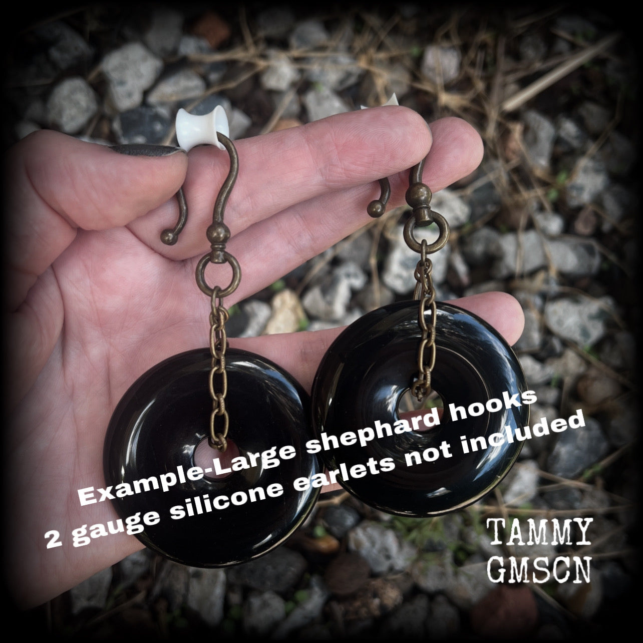 These gorgeous gemstone ear hangers feature beautiful black onyx donuts cradled in antique bronze chain, weighing approx. 24 grams a piece and measuring 8cms from tip to tip.
This pair has been made with large antique bronze shephards hooks, to be worn through earlets in stretched lobes from 2 gauge (6mm).