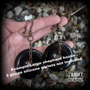 These gorgeous gemstone ear hangers feature beautiful black onyx donuts cradled in antique bronze chain, weighing approx. 24 grams a piece and measuring 8cms from tip to tip.
This pair has been made with large antique bronze shephards hooks, to be worn through earlets in stretched lobes from 2 gauge (6mm).