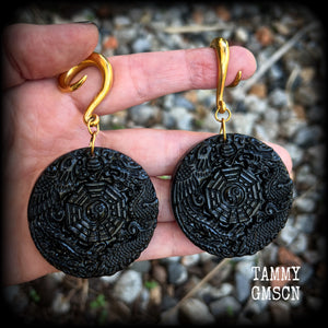 These gorgeous gauged earrings feature carved black obsidian pendants, showing a phoenix and dragon encircling the I-Ching hexagram.
These earrings weigh approx. 35 grams each and measuring just under 9cms from tip to tip.
This pair has been made with 2 gauge (6mm) surgical steel full curls, suitable for stretched lobes.