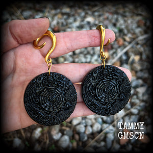 These gorgeous gauged earrings feature carved black obsidian pendants, showing a phoenix and dragon encircling the I-Ching hexagram.
These earrings weigh approx. 35 grams each and measuring just under 9cms from tip to tip.
This pair has been made with 2 gauge (6mm) surgical steel full curls, suitable for stretched lobes.