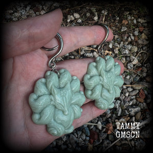 These gorgeous earrings feature carved Japanese jade kitsune, weighing approx. 25 grams each and measuring approx 7.5cms from tip to tip.
This pair have been made on 6 gauge (4mm) surgical steel full curls, suitable for stretched lobes.