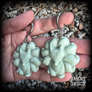 These gorgeous earrings feature carved Japanese jade kitsune, weighing approx. 25 grams each and measuring approx 7.5cms from tip to tip.
This pair have been made on 6 gauge (4mm) surgical steel full curls, suitable for stretched lobes.