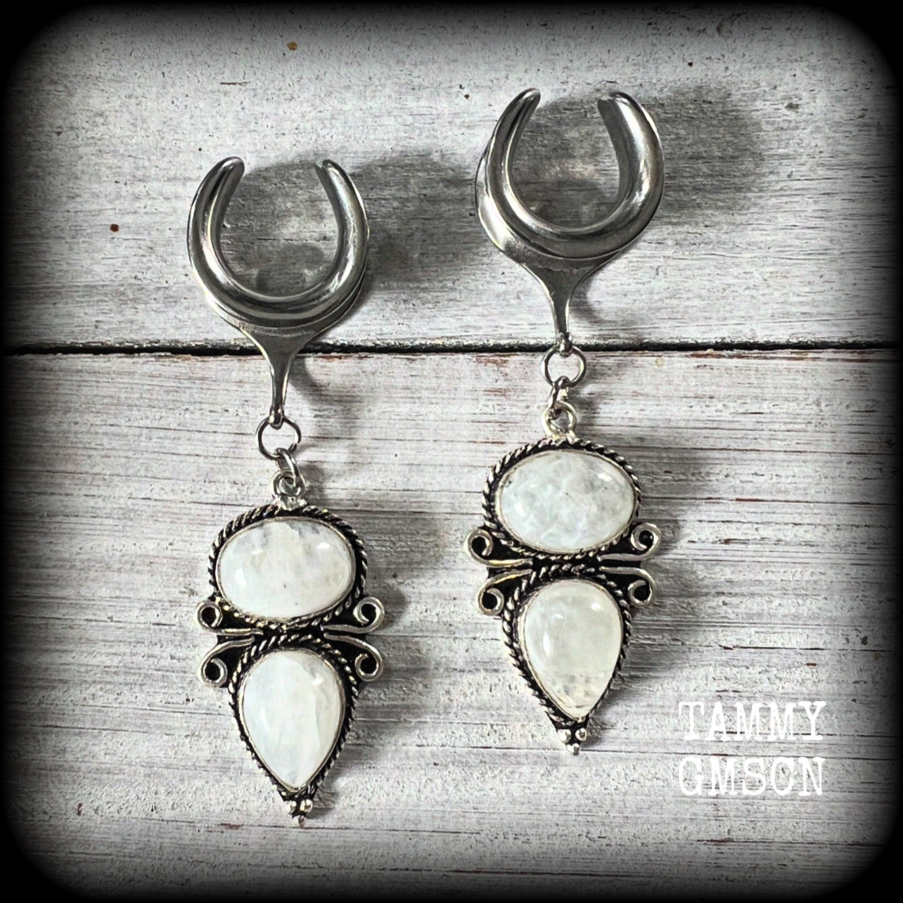 These beautiful boho moonstone earrings are made with gorgeous polished gemstones in an antique silver setting, lovely and dangly measuring approx 7cms from tip to tip, and weighing approx 12 grams each.

These earrings have been made on 5/8” gauge (16mm) surgical steel cradles, to be worn in stretched lobes.