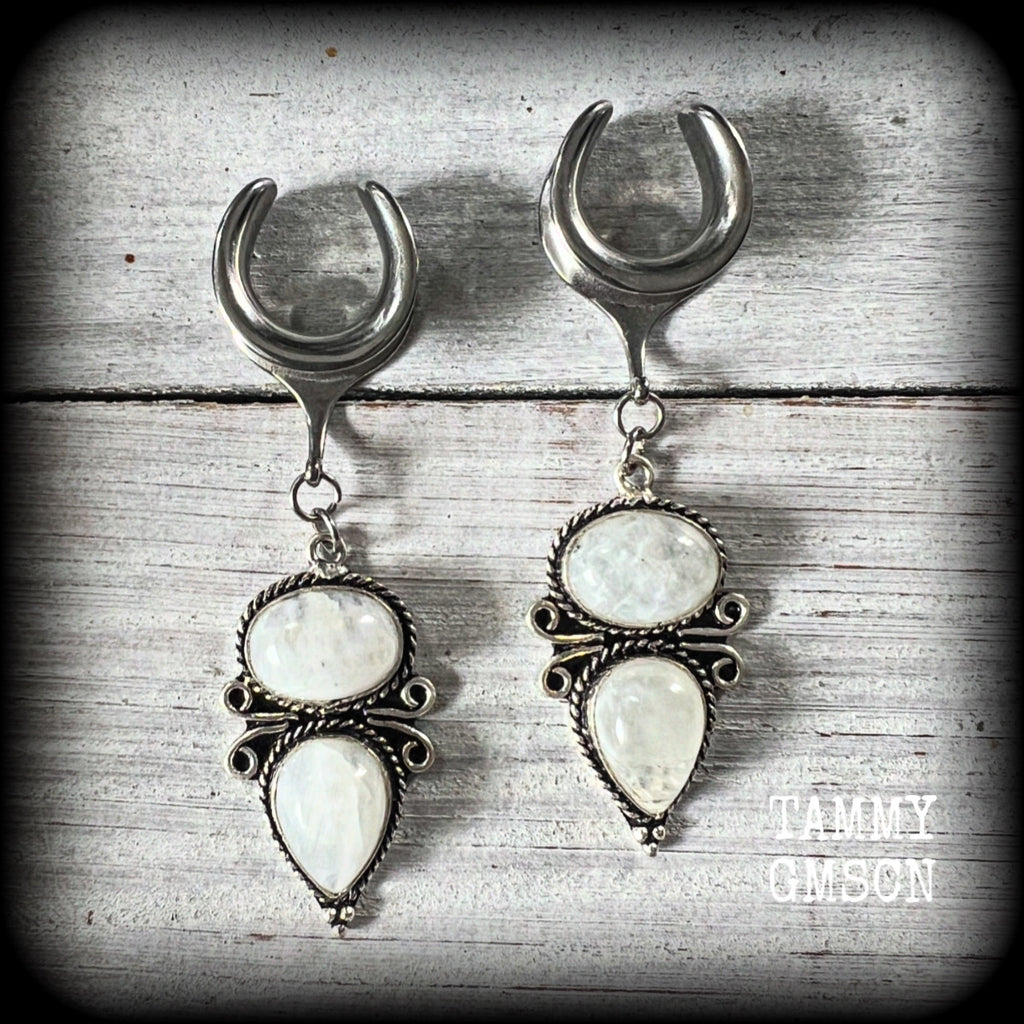 These beautiful boho moonstone earrings are made with gorgeous polished gemstones in an antique silver setting, lovely and dangly measuring approx 7cms from tip to tip, and weighing approx 12 grams each.

These earrings have been made on 5/8” gauge (16mm) surgical steel cradles, to be worn in stretched lobes.